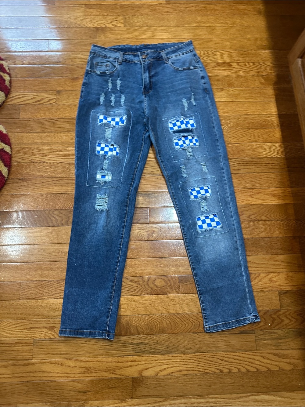Distressed Blue Jeans with Blue Checkerboard Patch Details